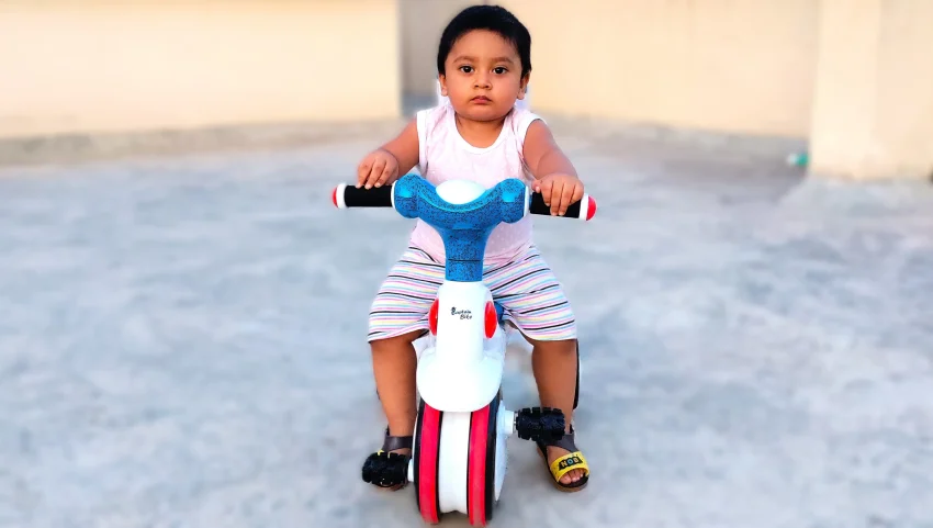 A joyful moment while riding baby tricycle